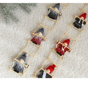 Detail of plush felt Santa Claus climbing a wooden ladder Christmas tree hanging ornament