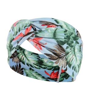 Detail of blue tropical floral yoga headband featuring a stylish front knot design
