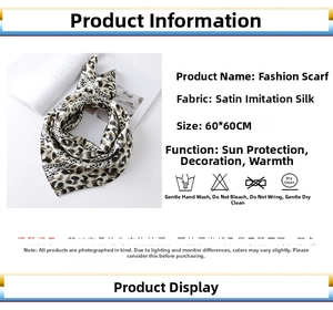Detailed view of satin faux silk square scarf with trendy leopard print and smooth texture