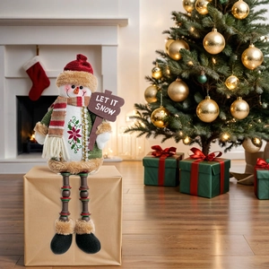 Detail of plush Christmas snowman with long beaded legs sitting on a gift box