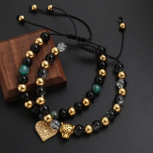 Adjustable beaded bracelet set featuring gold heart and leopard head charms on stone beads