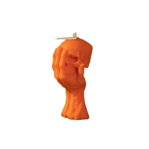 Orange skull scented candle on skeletal hand base for Halloween decor centerpieces