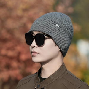 Thick grey knitted beanie for men with vertical ribs and square metal logo for winter