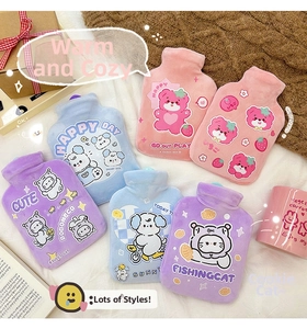 Flat lay of colorful plush cartoon hot water bottles with cute animal illustrations