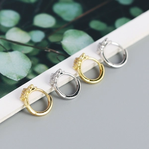 Detailed view of small s925 silver star hoop earrings in gold and silver finishes