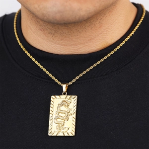 Gold-plated dragon pendant necklace with twisted chain on black apparel background