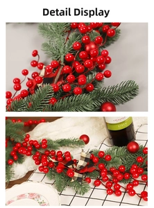 Detail of Christmas garland with pine needles, red berries and festive ornaments