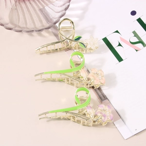 Three-piece gold metal tulip hair clips in white, pink, and purple enamel finishes