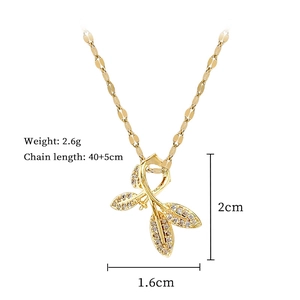 Detailed view of gold leaf pendant with crystal inlay showing dimensions 2cm by 1.6cm