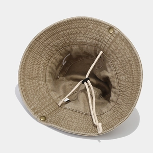 Vintage washed cotton bucket hat in khaki with wavy stitching and windproof rope