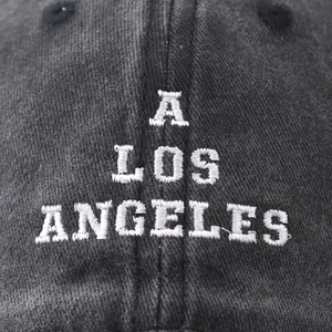 Washed cotton baseball cap with Los Angeles embroidery and distressed vintage texture