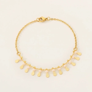 Detail of gold chain bracelet with pink beads and drop-shaped metallic sequins