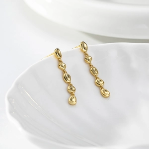 Elegant gold S925 sterling silver long tassel earrings on white shell plate
