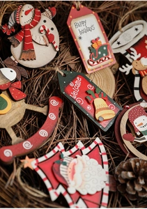 Detailed view of hand-painted wooden Christmas ornaments with rustic jute hanging ropes