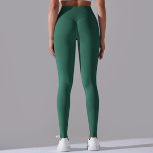Detail view of seamless yoga leggings with high waist crossover and peach butt lift texture