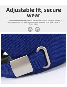 Detail of adjustable metal buckle and breathable knit fabric on blue baseball cap