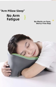 Close-up of ergonomic U-shaped memory foam pillow showing arm support for comfortable napping