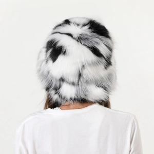 Detail view of the black and white faux fur texture on this plush camo bucket hat