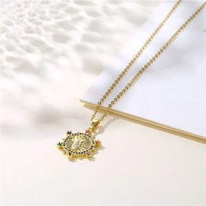 Golden Virgin Mary pendant necklace with colorful gemstones on a minimalist gold chain