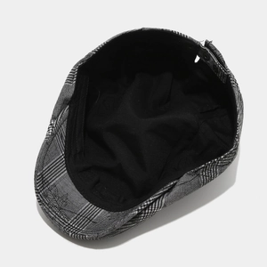 British style newsboy cap with black and white plaid pattern and metal adjustable buckle