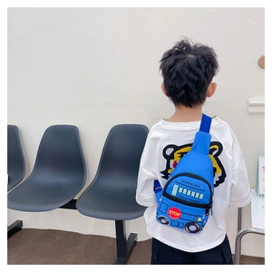 Child wearing a bright blue school bus chest bag with an adjustable strap