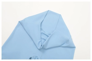 Detail of high-waisted light blue yoga pants showing premium stitching and matte fabric
