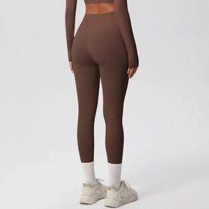 Detail view of high waist coffee brown yoga leggings showing lifting effect and fit