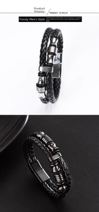 Detail of black braided leather bracelet with silver magnetic clasp and metal beads