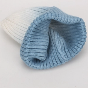 Chic tie-dye knitted beanie for women featuring a blue and white gradient ribbed texture