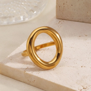 Minimalist 18K gold-plated oval hollow ring displayed on a textured stone base