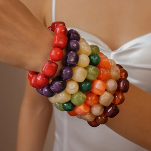 Colorful acrylic beaded bracelet with vibrant oversized square and round charms on wrist