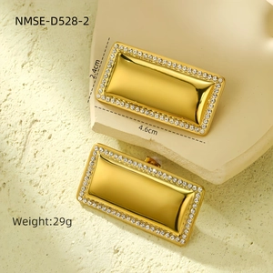Macro detail of 18k gold plated rectangular earrings with white crystal inlay and dimensions