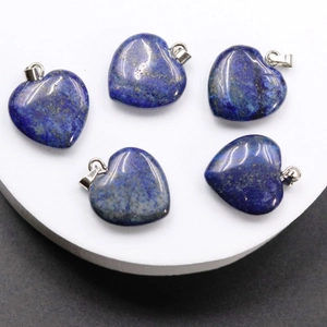 Close-up of five heart-shaped lapis lazuli pendants with golden specks and silver clasps