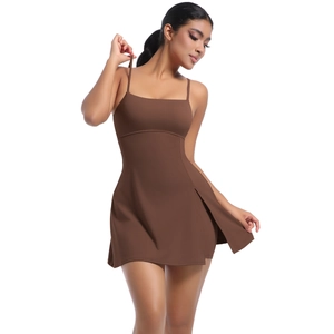Close-up of the side slit detail on a dark brown athletic dress with premium fabric