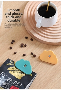 Detail of cloud-shaped sealing clips in mint green and yellow for food freshness