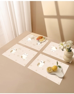 Waterproof disposable table mat for kids featuring cute cartoon cat patterns on beige background