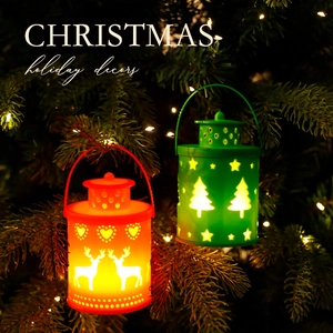 Christmas lantern ornaments with reindeer and tree patterns in festive red and green