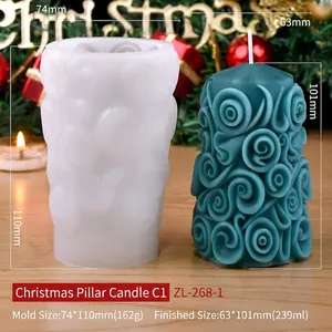 Spiral Christmas cylinder silicone mold with finished blue candle on wooden table