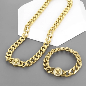 Macro shot of gold-plated Cuban link necklace set with sparkling CNC diamond circle clasp