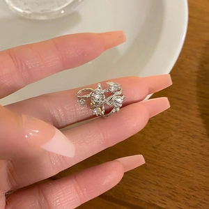 Elegant silver flower ring with sparkling zircon stones in a delicate layered design