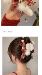 Detail of Christmas hair claw with red plaid bow, white fur pom and jingle bells
