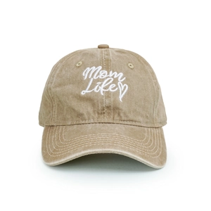 Detailed view of white Mom Life embroidery and heart on washed cotton baseball cap