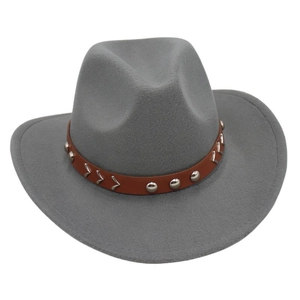 Detail of grey wool fedora hat featuring a brown faux leather band with silver metal studs