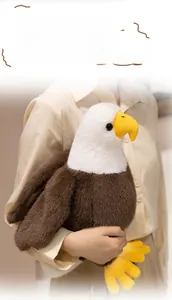 Detailed view of bald eagle plush toy with soft white feathers and realistic brown fur