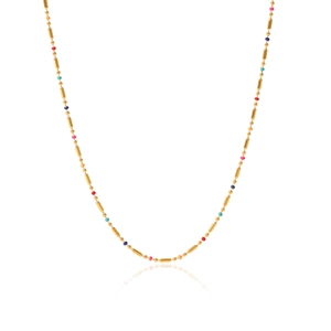 Detailed view of golden necklace chain featuring colorful natural stone round beads