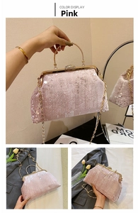 Detail of pink sequin clutch bag with metal ring handle and sparkling rhinestone clasp