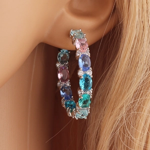 Elegant large silver hoop earrings featuring colorful oval gemstones and cubic zirconia