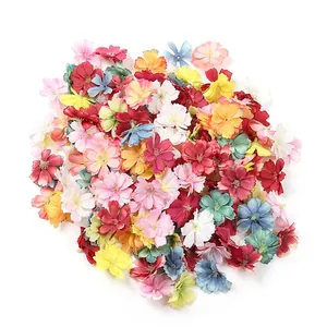 Mix of colorful artificial plum blossom heads for DIY hair ornaments and craft projects