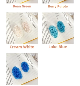 Detail of plush lamb wool hair clips in various candy colors with French retro magazine background