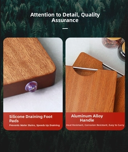 Detail of ebony wood cutting board with aluminum handle and purple silicone feet